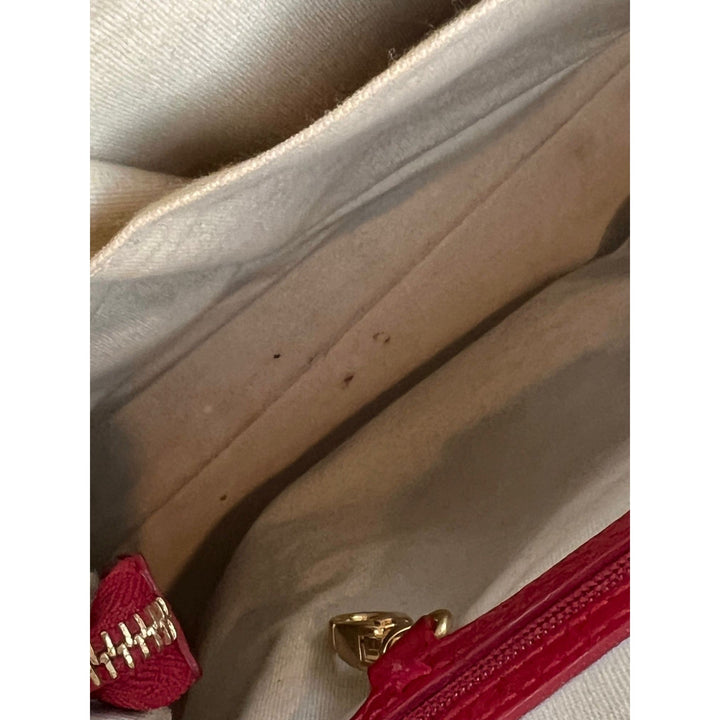 Interior view of Isabella Fiore Red Patent Leather Hand bag, showing minor marks on the lining, ideal luxury bags.