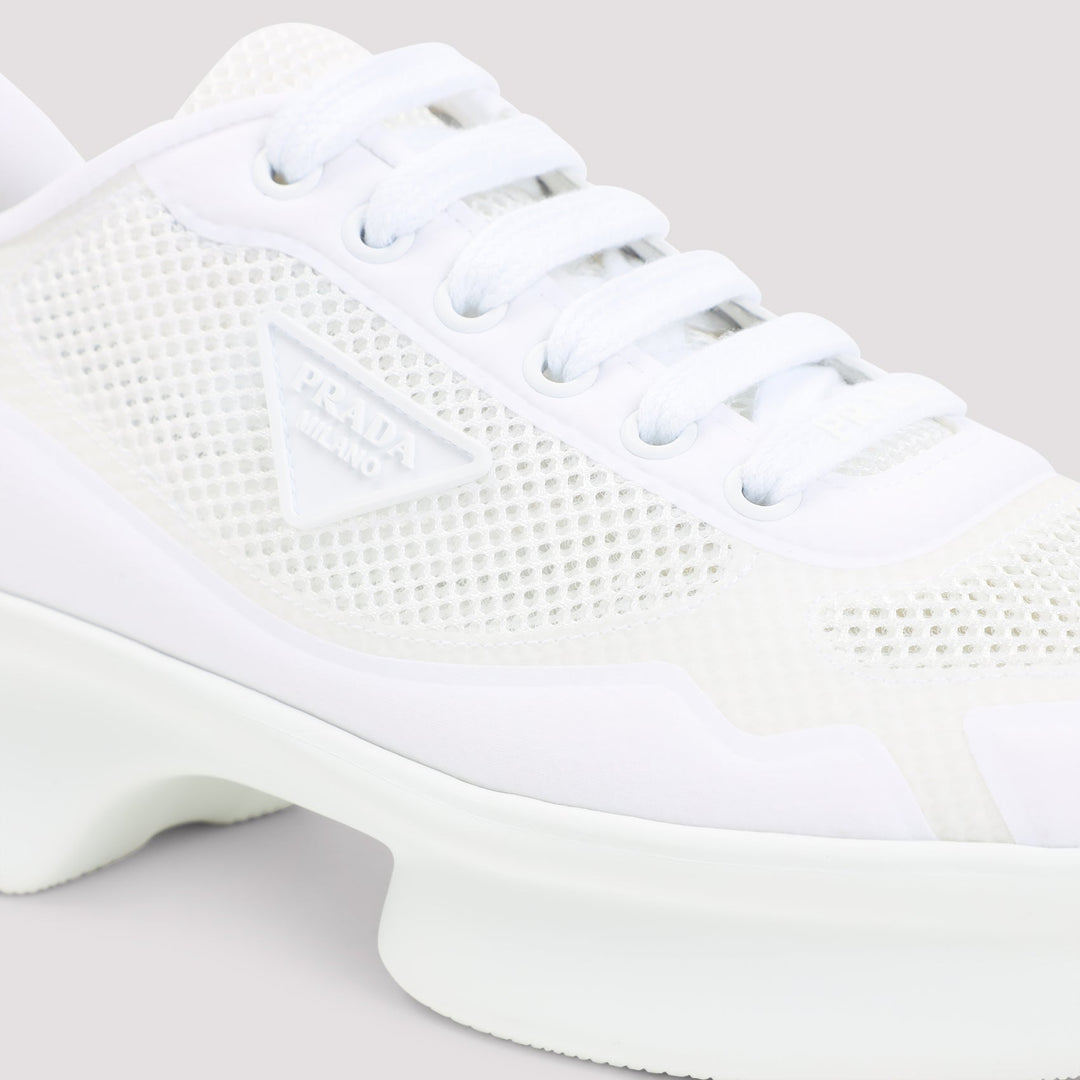 White sneaker with mesh design on a light gray background