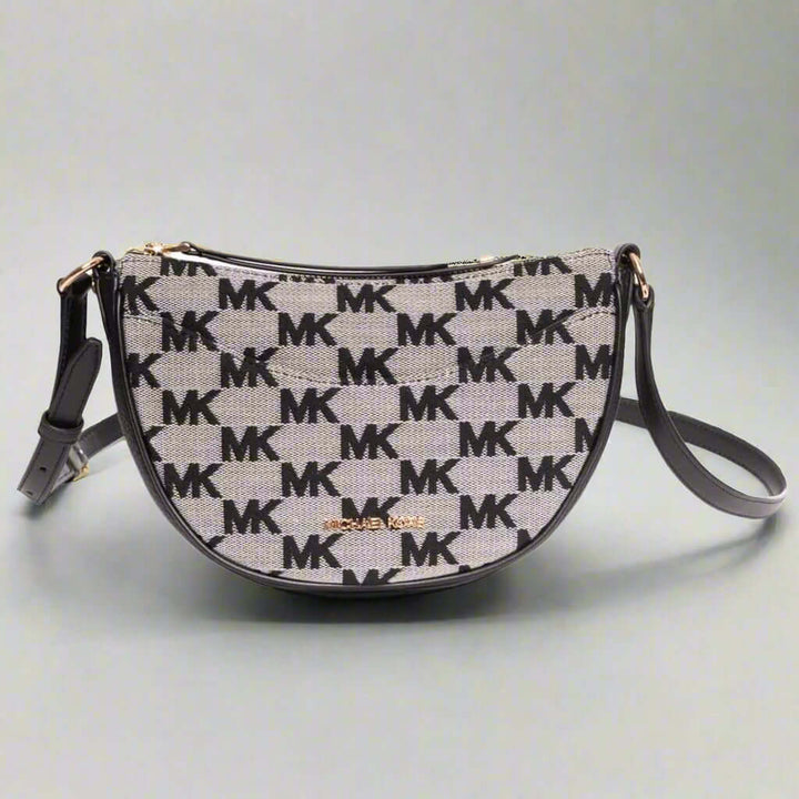 Michael Kors handbag with logo pattern on a white background