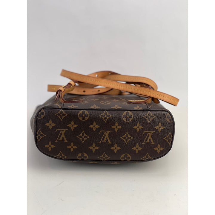 LOUIS VUITTON Montsouris NM Monogram Backpack bottom view showcasing luxury bag details and logo.