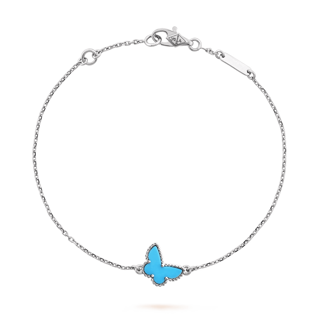 Van Cleef & Arpels Sweet Butterflies bracelet 18K white gold, Turquoise on display showcasing fine jewelry design.