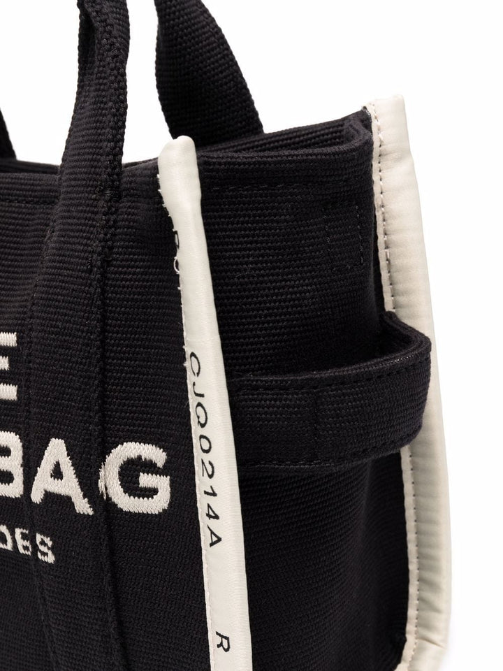 Black bag with white text and a strap on a white background