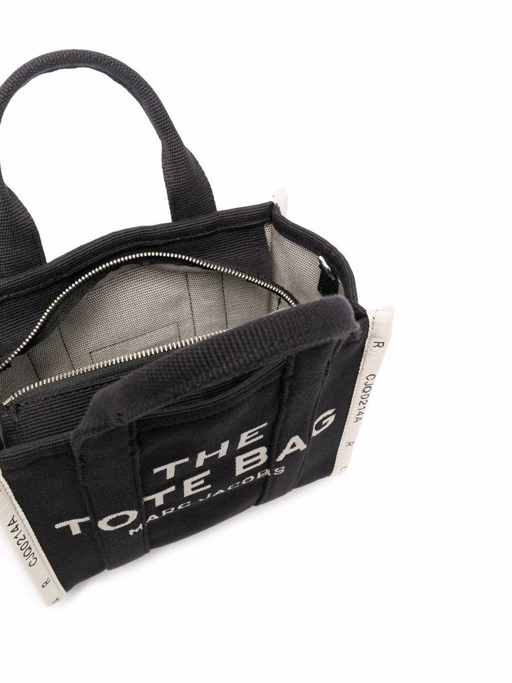 Black tote bag with 'The Tote Bag' text on a white background