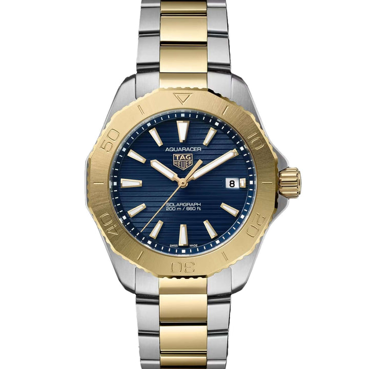 Two-tone gold and silver watch with blue dial on a white background