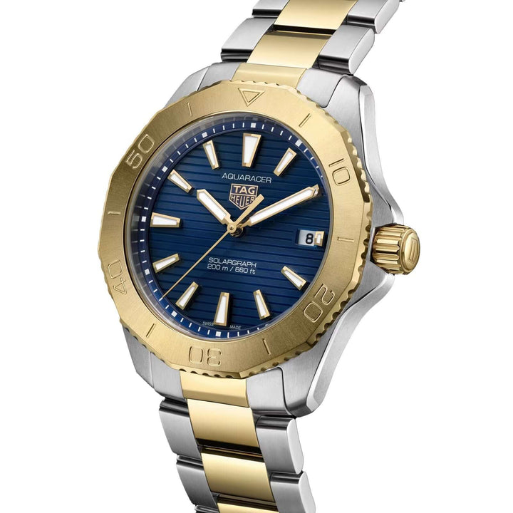Two-tone gold and silver watch with blue dial on a white background