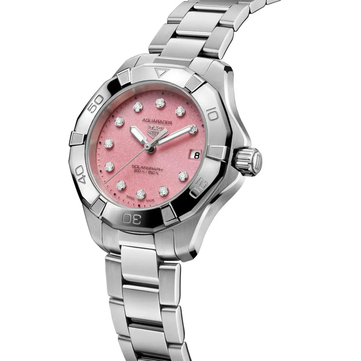 Silver watch with a pink face on a white background
