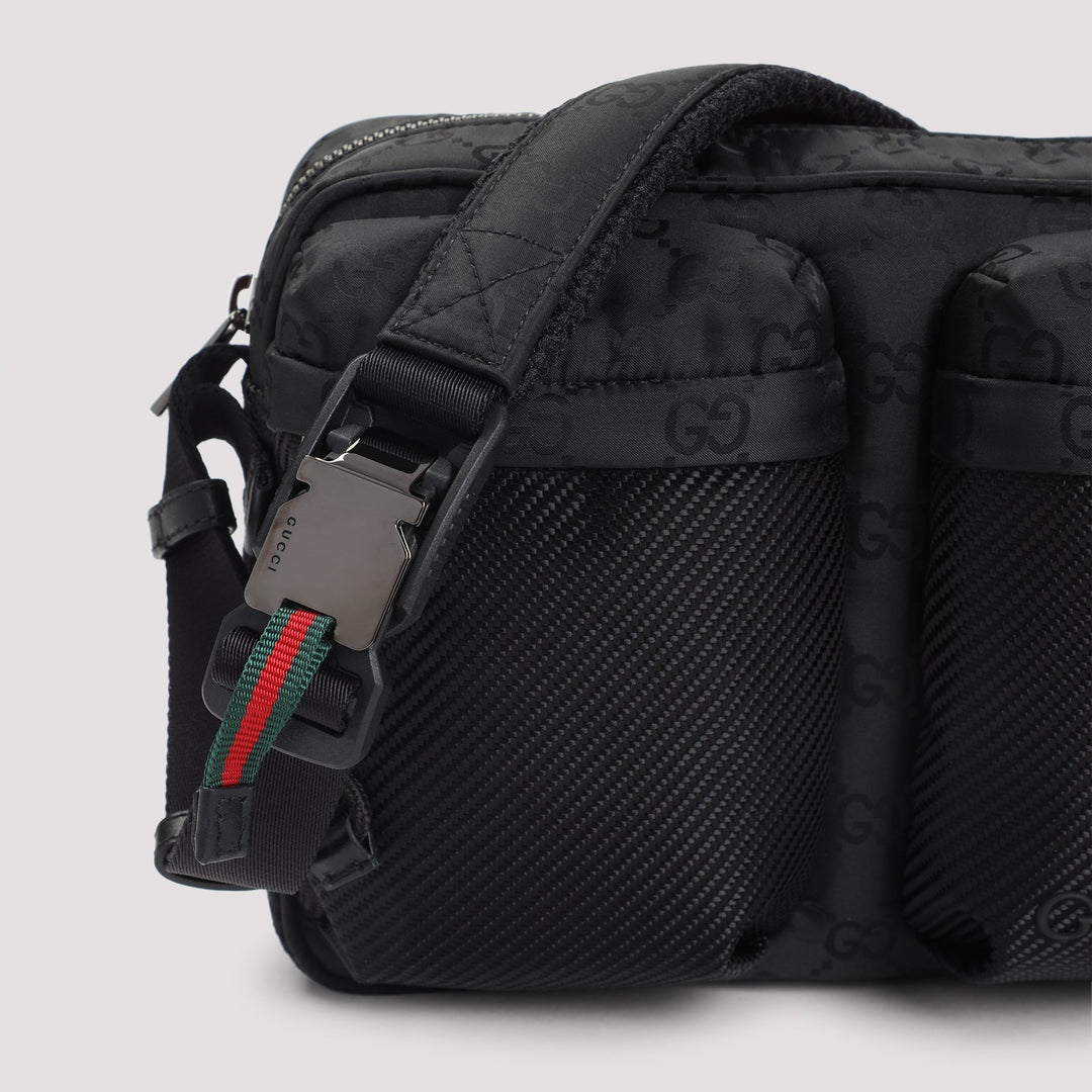 Black textured bag with a visible brand logo on a light gray background