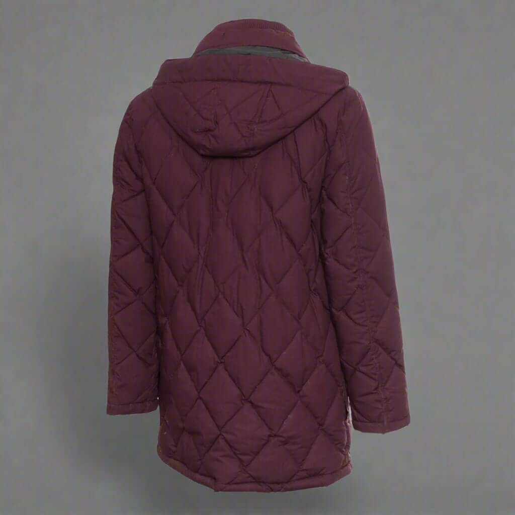 Maroon quilted jacket on a white background