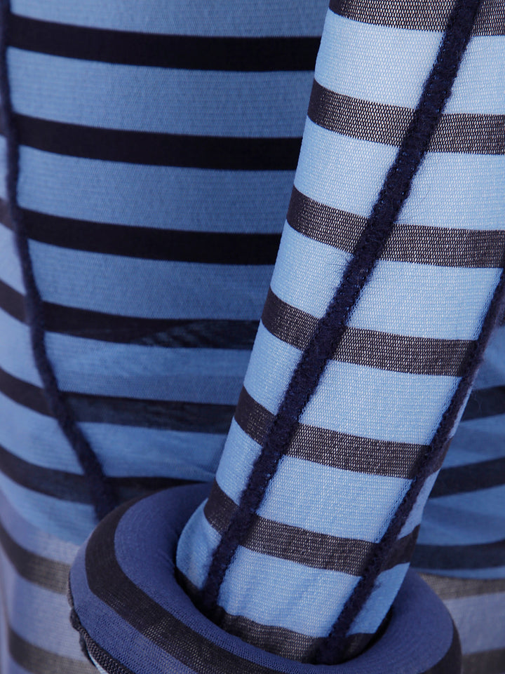 Close-up of blue and brown striped fabric with a focus on texture and pattern.