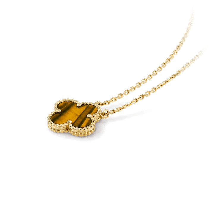 Van Cleef & Arpels Vintage Alhambra pendant 18K yellow gold, Tiger Eye on a fine jewelry necklace.