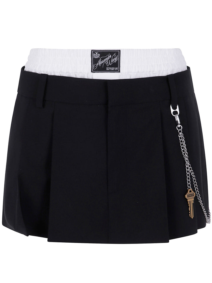 Black skirt with white waistband and keychain detail on a white background