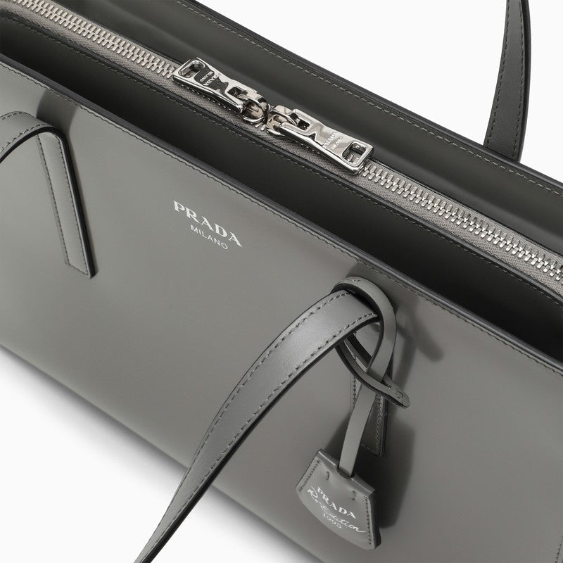 Gray Prada handbag with visible brand logo on a white background