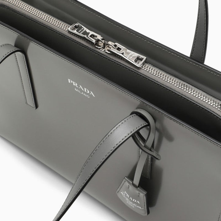 Gray Prada handbag with visible brand logo on a white background