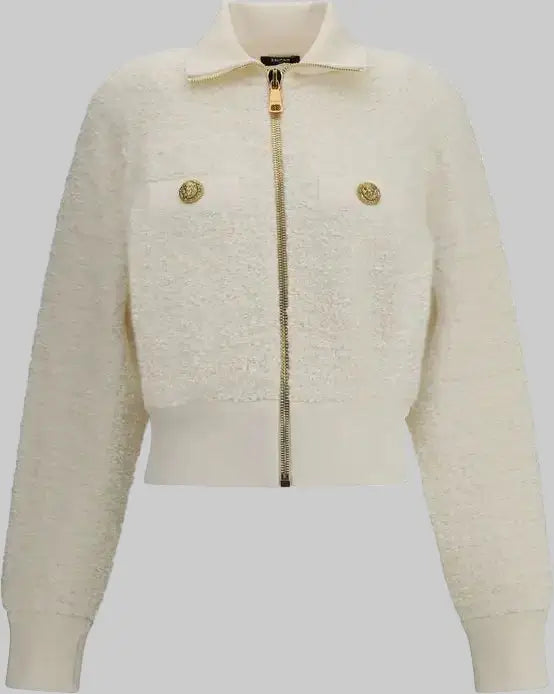 White textured jacket with gold zipper and buttons on a white background