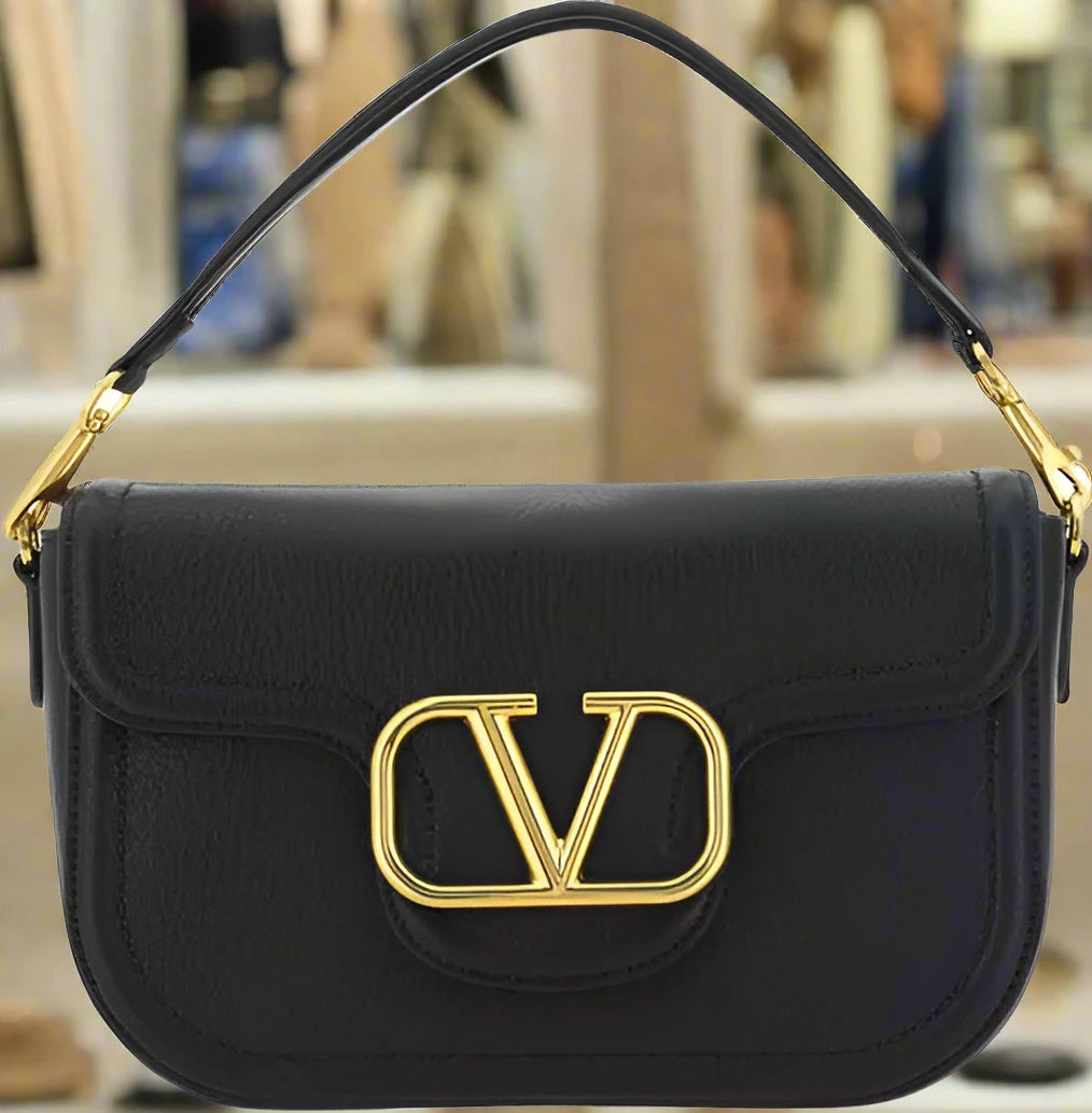 Valentino Garavani women's designer handbag in leather Luxury Valentino Garavani shoulder bag with iconic studs Valentino Garavani crossbody bag in black with gold accents