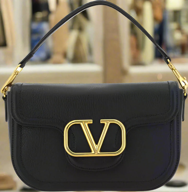Valentino Garavani women's designer handbag in leather Luxury Valentino Garavani shoulder bag with iconic studs Valentino Garavani crossbody bag in black with gold accents