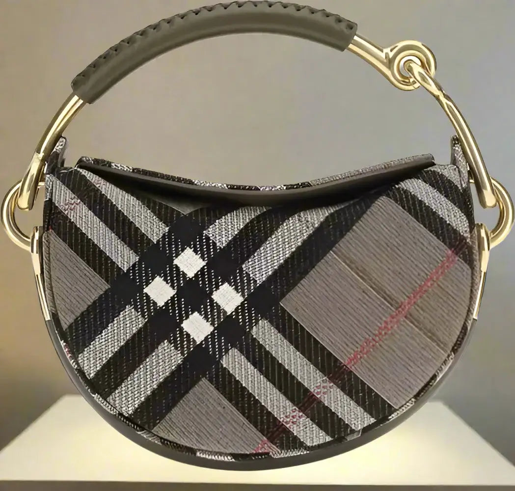 Plaid patterned handbag with gold handle on a white background