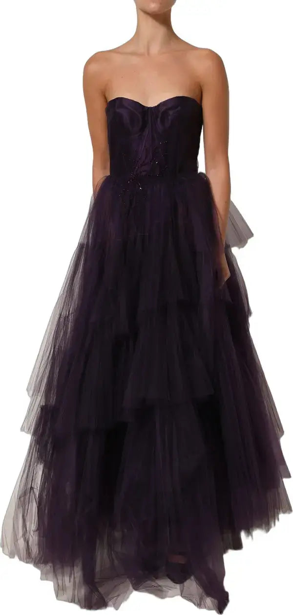 Purple strapless gown with layered skirt on a white background
