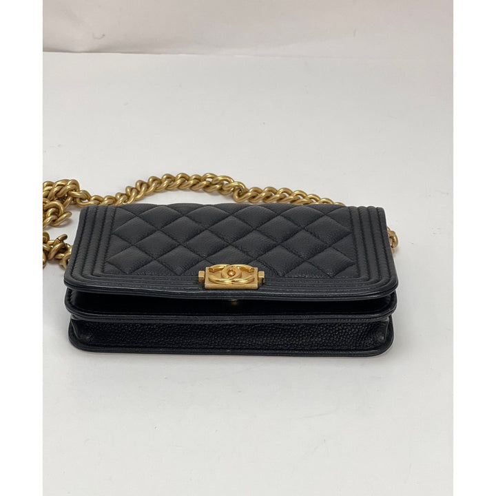 Chanel Caviar Quilted Mini Boy Clutch Wallet on a Chain Black with gold hardware and classic quilted design.