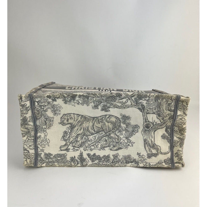 Fabric pouch with tiger design on a plain background