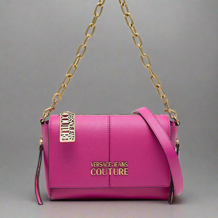 Versace Jeans Couture shoulder bag in pink synthetic leather with gold emblem and chain strap, stylish across-body design.