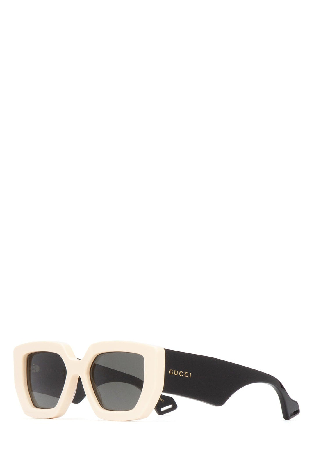 Sunglasses with a beige frame and black arm on a white background