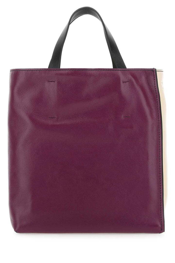Purple tote bag with black handles on a white background
