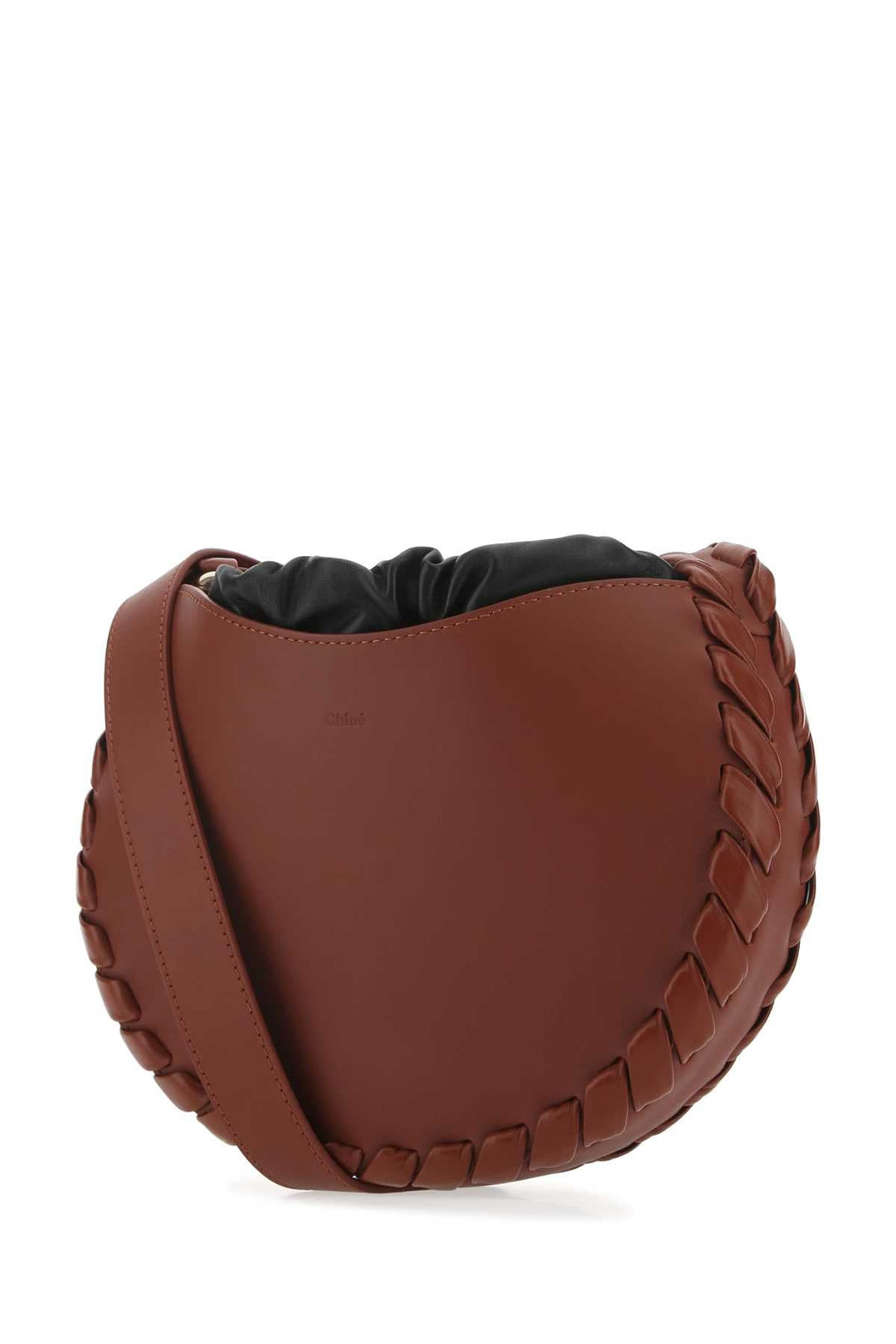 Brown leather saddle pad with braided edge on a white background