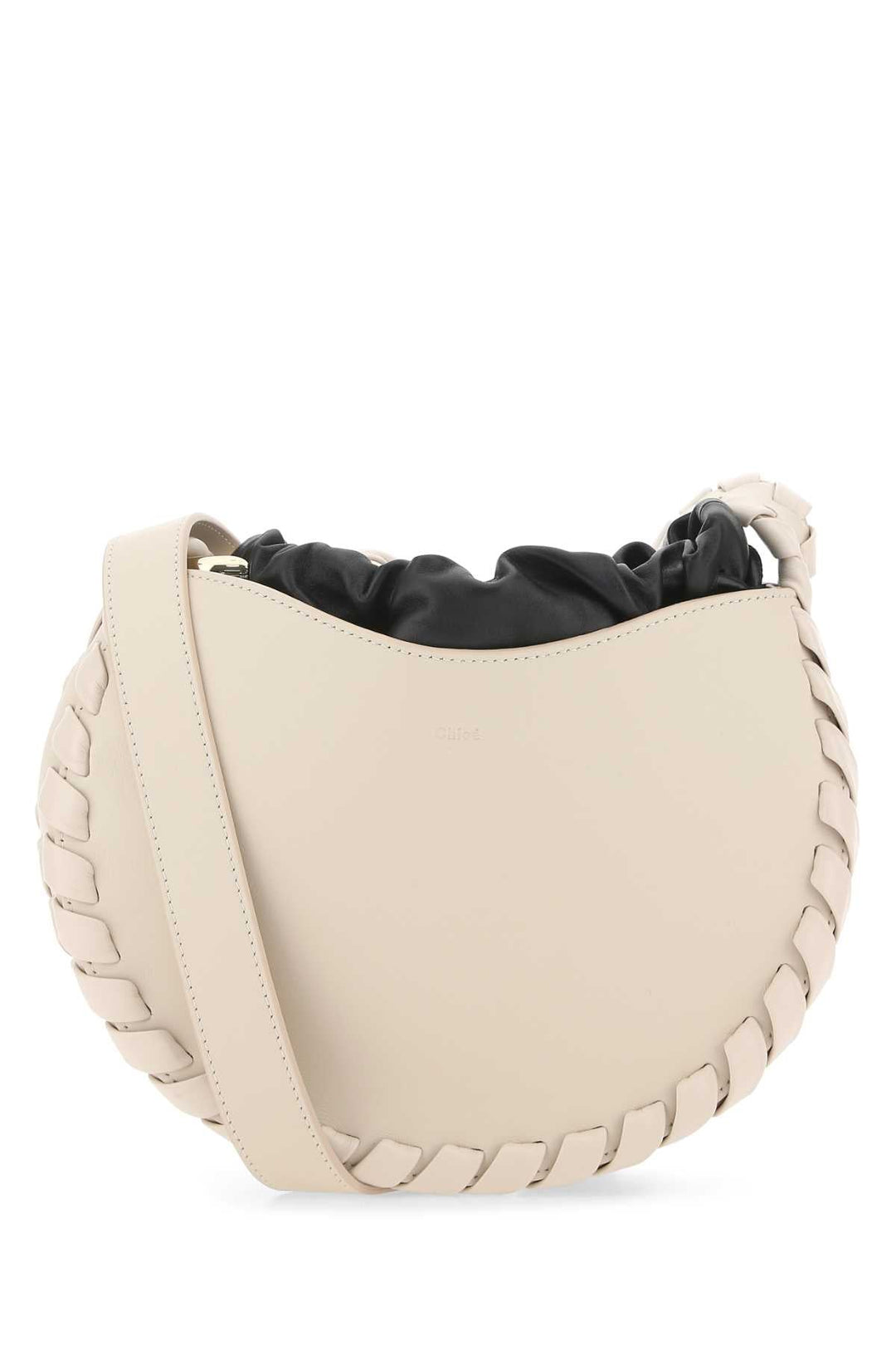 Beige handbag with black interior on a white background