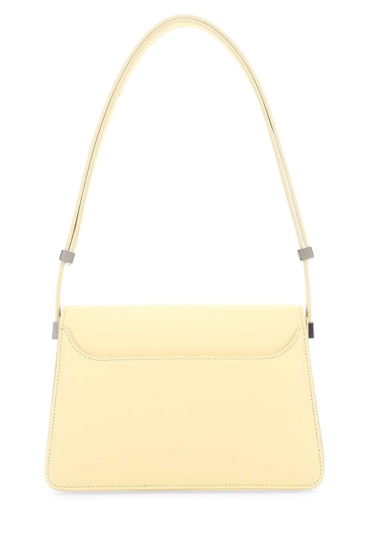 Yellow handbag with a strap on a white background