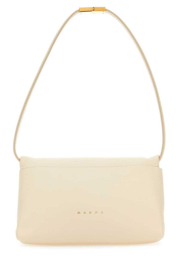 Cream-colored handbag with a gold chain strap on a white background