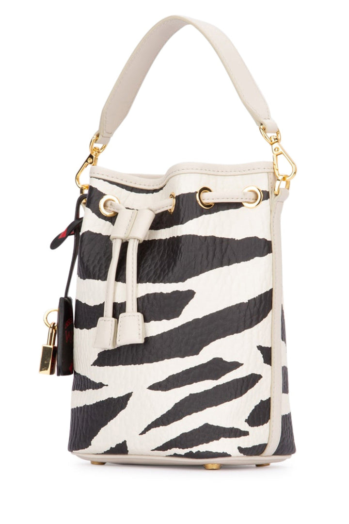 Zebra print bucket bag with gold accents on a white background