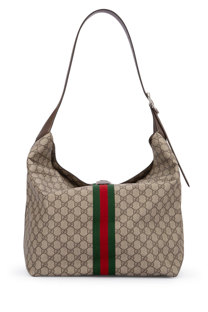 Beige handbag with a red and green stripe on a white background