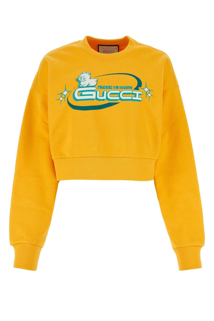 Yellow Gucci sweatshirt with logo on a white background