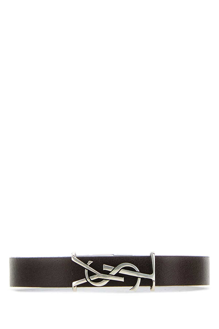 Black leather belt with silver buckle on a white background