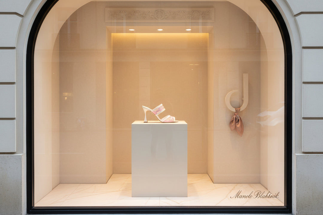 White and pink high-heeled sandal on a white background
