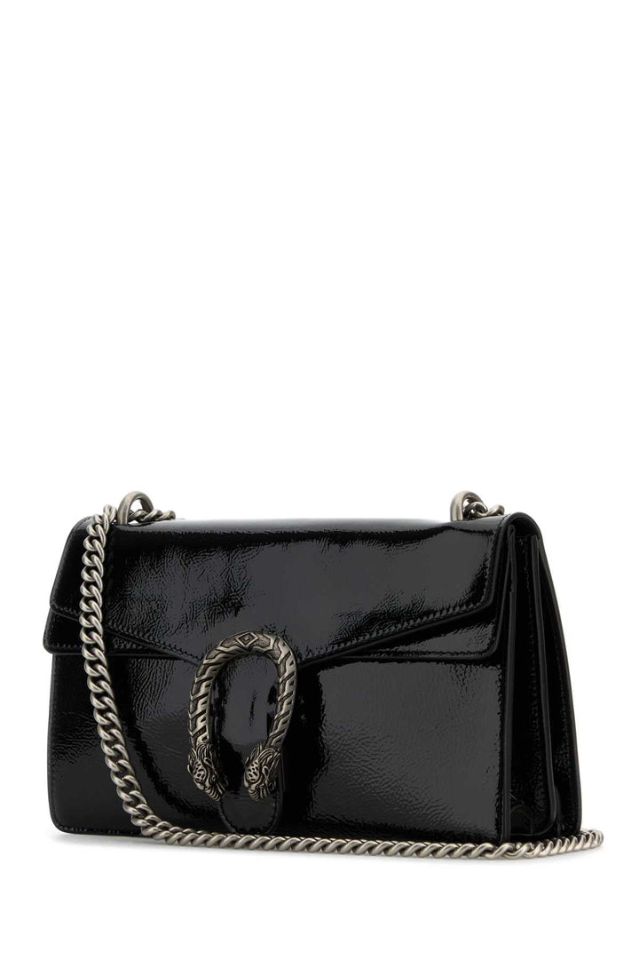 Black handbag with chain detail on a white background