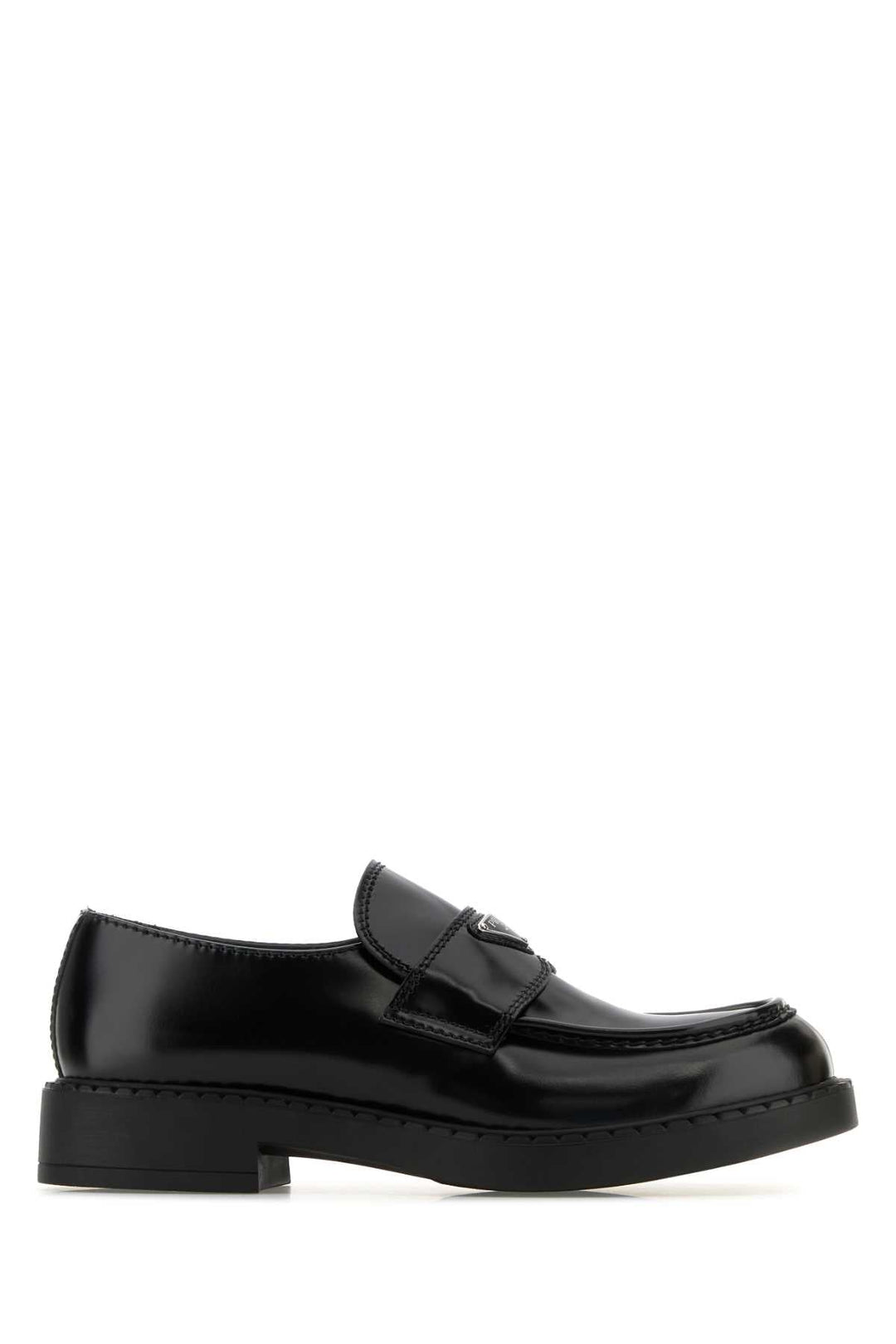Black loafers on a white background
