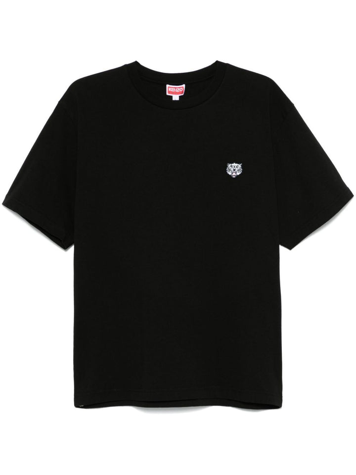 Black t-shirt with a small logo on a white background