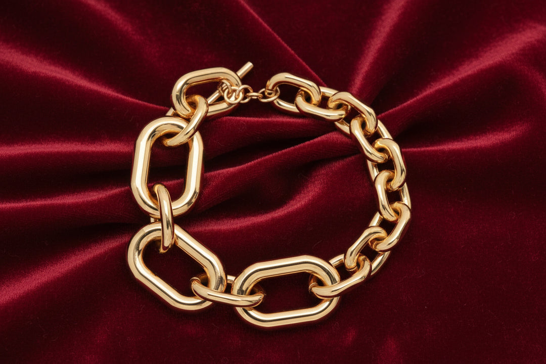 Gold chain bracelet on a white background