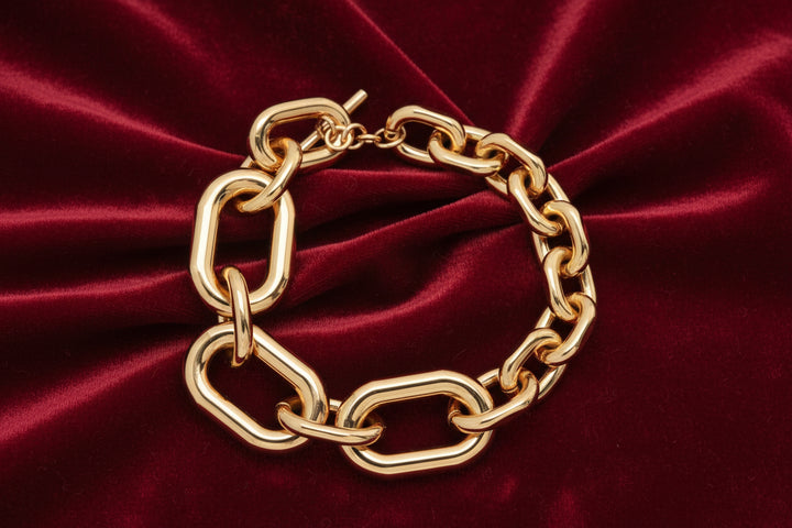 Gold chain bracelet on a white background