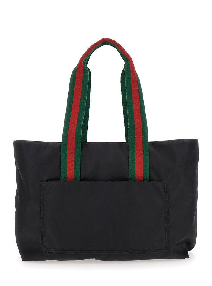 Gucci Men Black Tote Bag With Web Handles And Logo Lettering On The Front In Tech Fabric Man