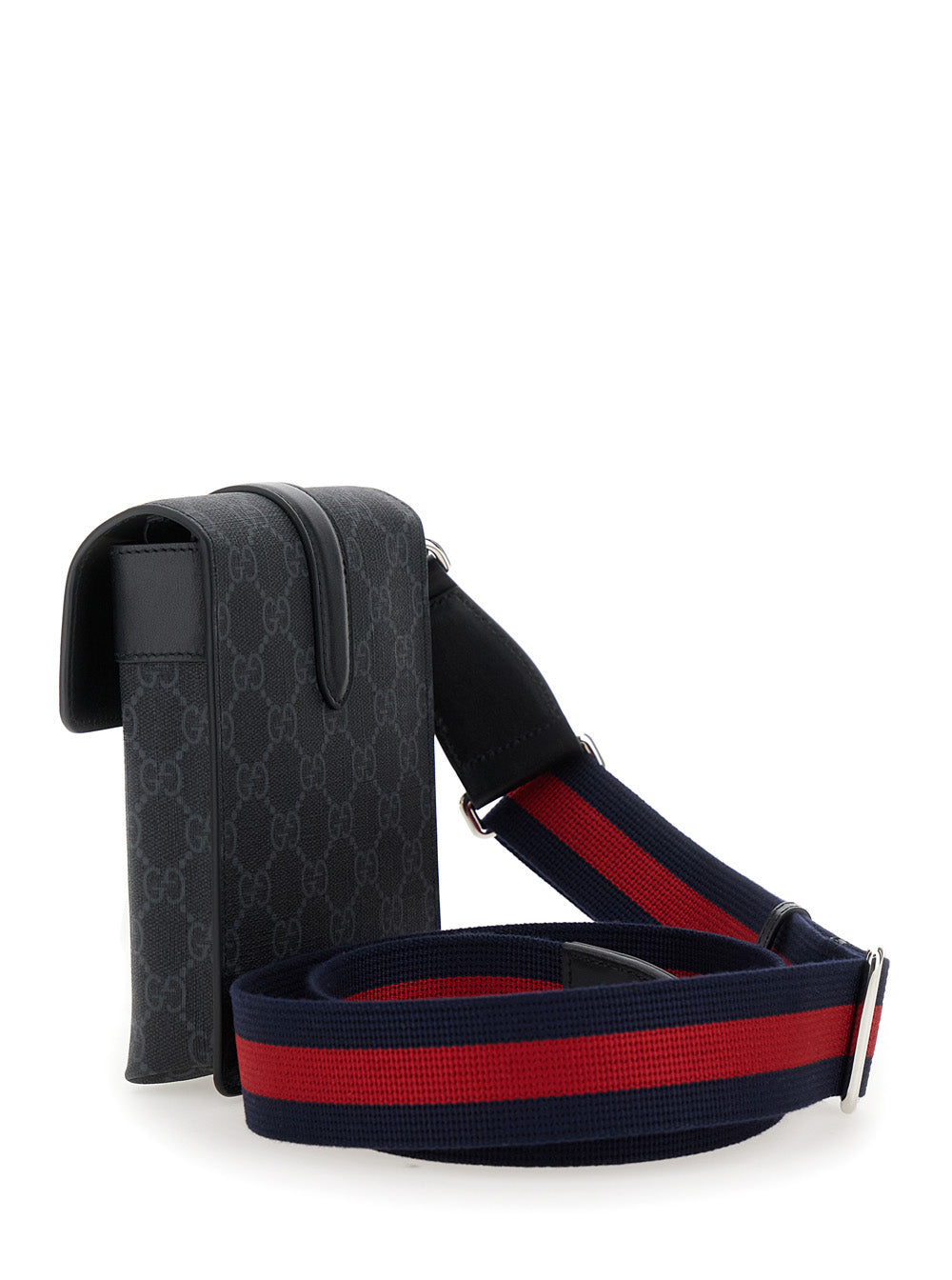 Black patterned bag with a red and blue strap on a white background