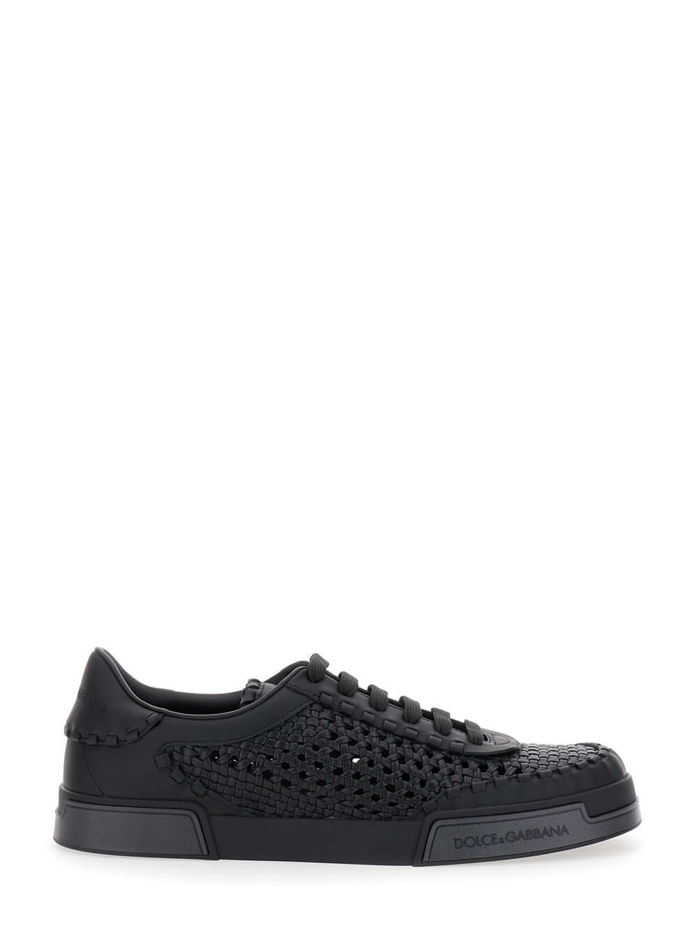 Black sneaker with detailed sole on a white background