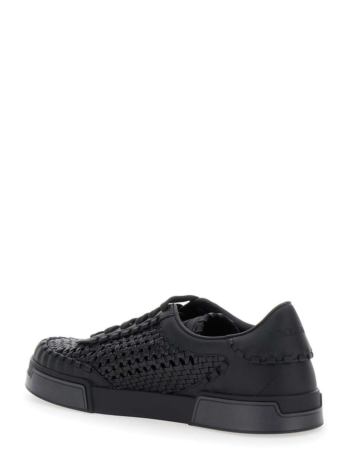 Black woven sneaker on a white background