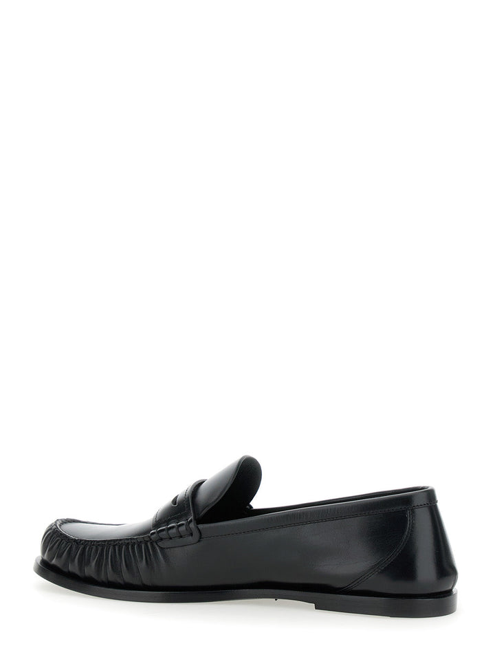 Saint Laurent Men 'Penny' Black Loafers With Metal Cassandre Logo And Curled Toe In Leather Man