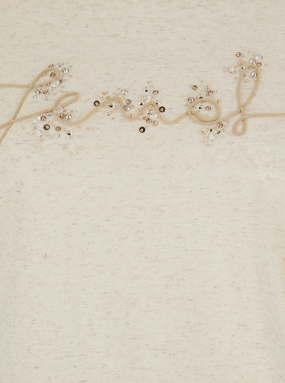 Decorative string with beads spelling 'Felicity' on a textured beige background