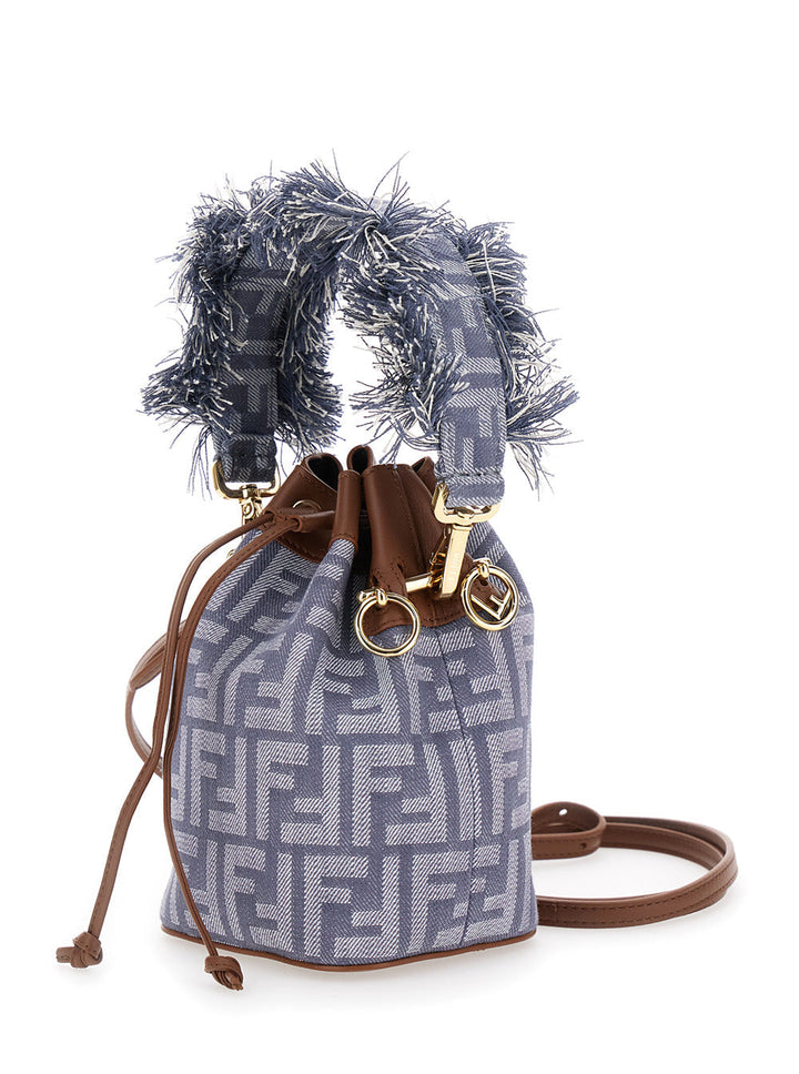 Designer handbag with decorative elements on a white background