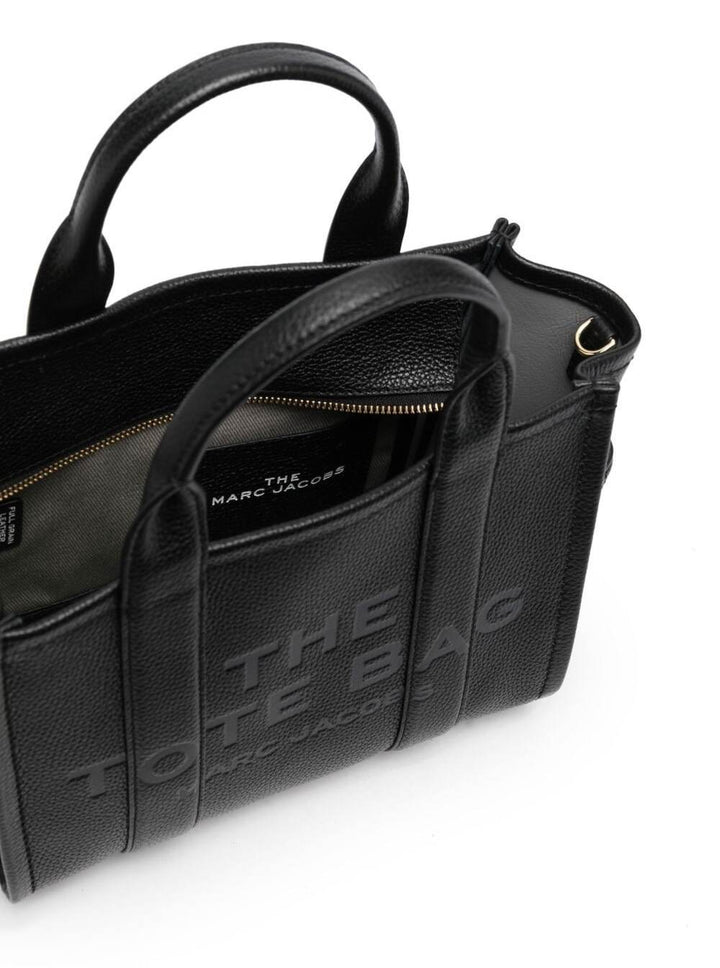 Black tote bag with 'The Tote Bag' text on a white background