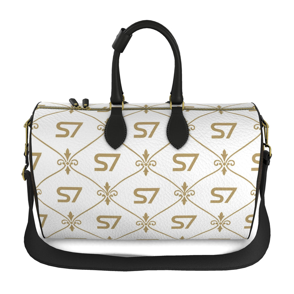 S7 Champagne Royale duffle bag with a white body, champagne-gold S7 monograms and ornate lattice, chocolate-brown sides, and black handles.